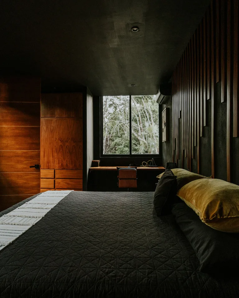 Modern bedroom with warm wooden panel walls