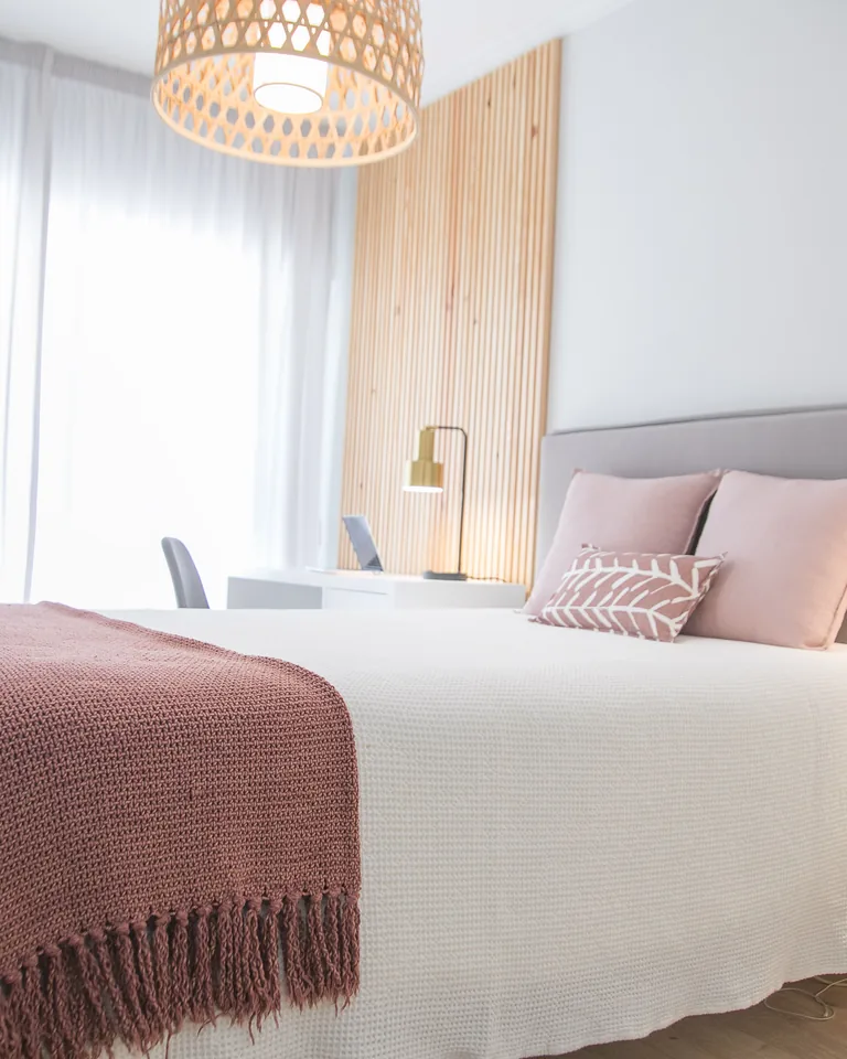 Bright minimalist bedroom with natural light and soft neutral colors
