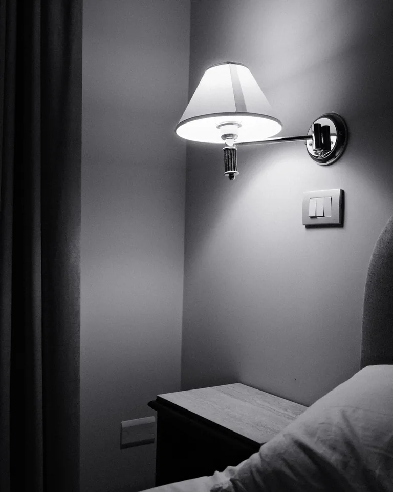 Elegant bedside lamp styled on a nightstand in a cozy bedroom