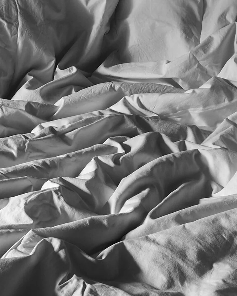 Crumpled white cotton duvet cover with natural texture