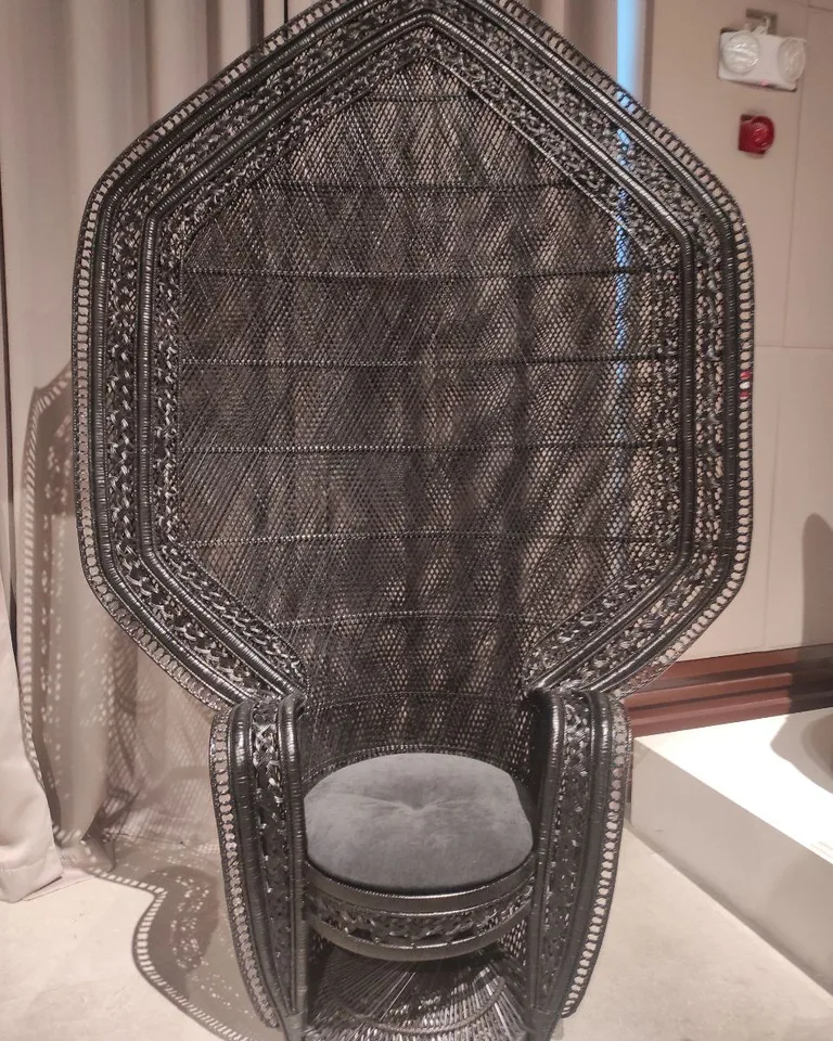 Woven rattan accent chair with natural texture